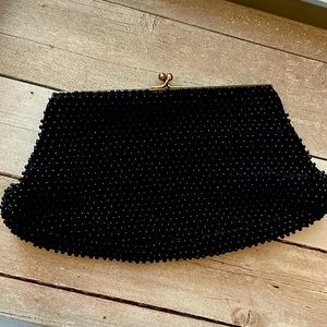 Black vintage clutch with gold accent for closure